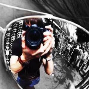 Fotógrafo Reflejado en Gafas de Sol