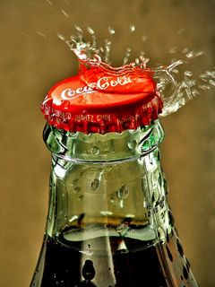 Botella de Coca-Cola con Salpicadura