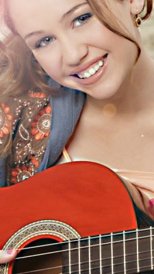 Miley Cyrus con Guitarra